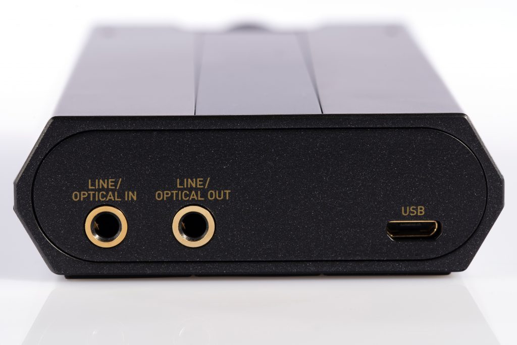 Detail of the optical input and output and USB port of an external sound card and DAC isolated on white background